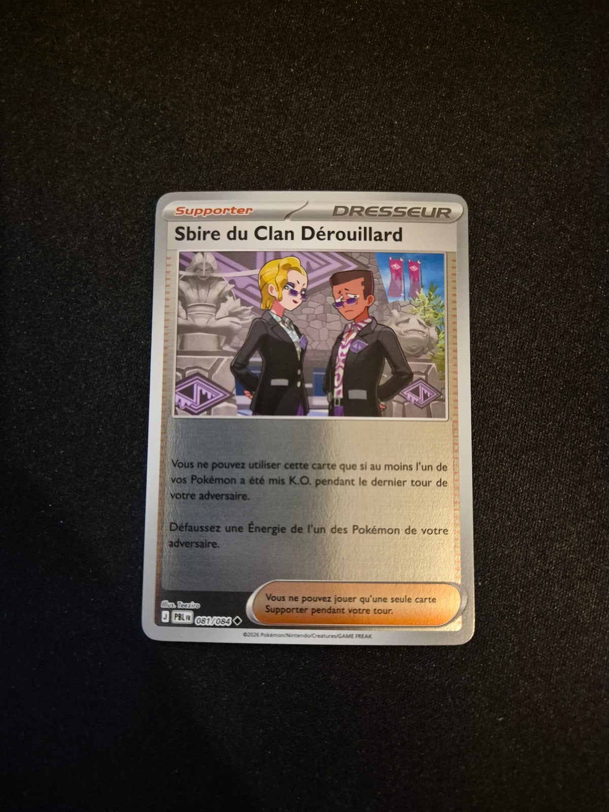 Carte Pokémon Sbire du Clan Dérouillard Reverse 081/084 ME05 Nuit Noire