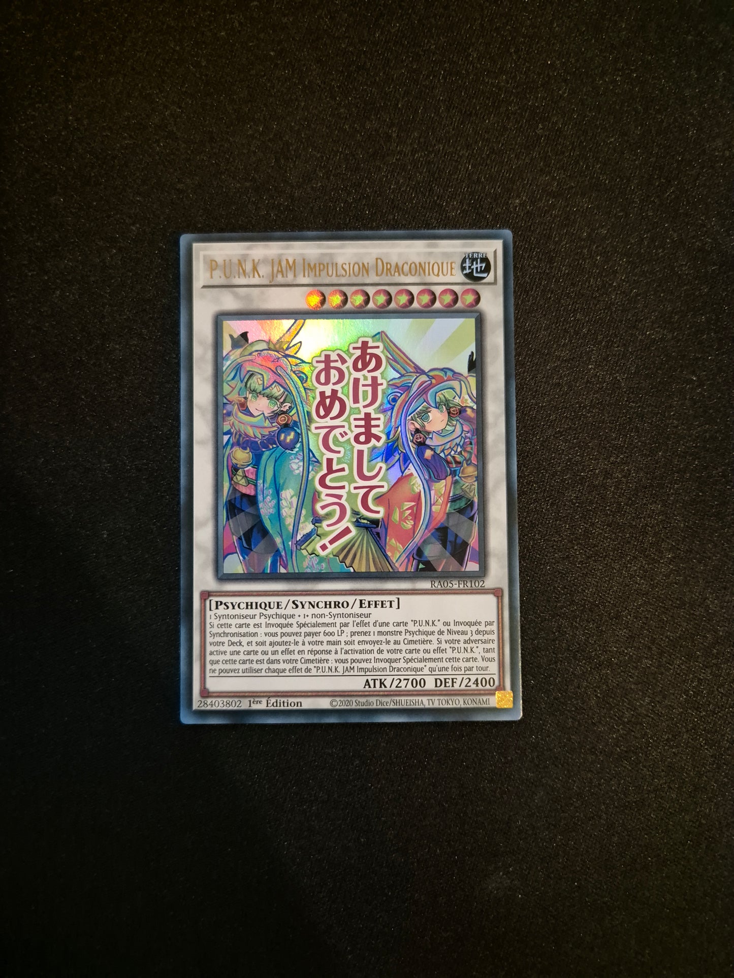 Carte Yu-Gi-Oh! P.U.N.K. JAM Impulsion Draconique ALT Stamped Ultra Rare RA05-FR102