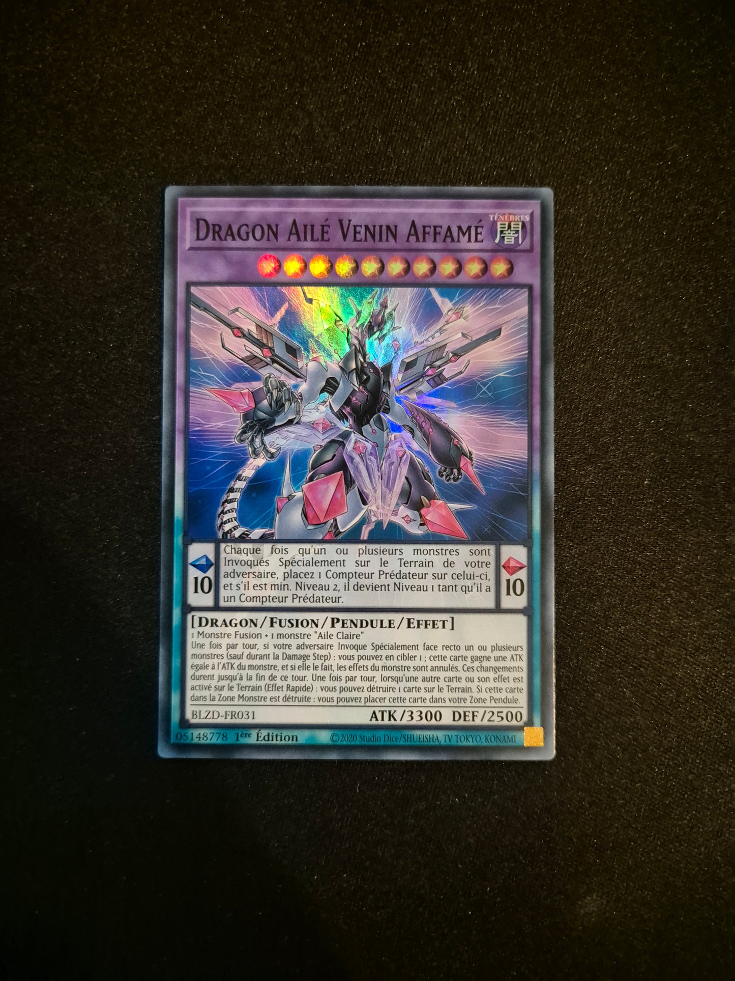 Carte Yu-Gi-Oh! Dragon Ailé Venin Affamé Super Rare BLZD-FR031