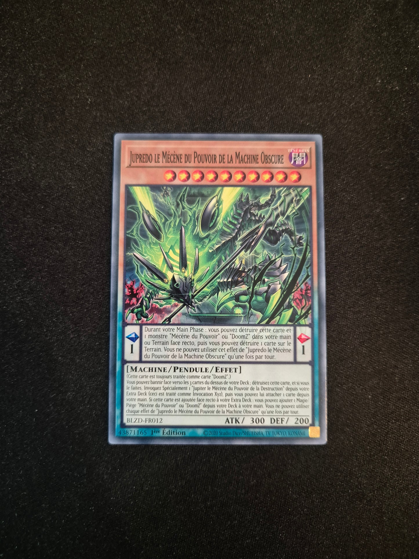 Carte Yu-Gi-Oh! Jupredo le Mécène du Pouvoir de la Machine Obscure BLZD-FR012